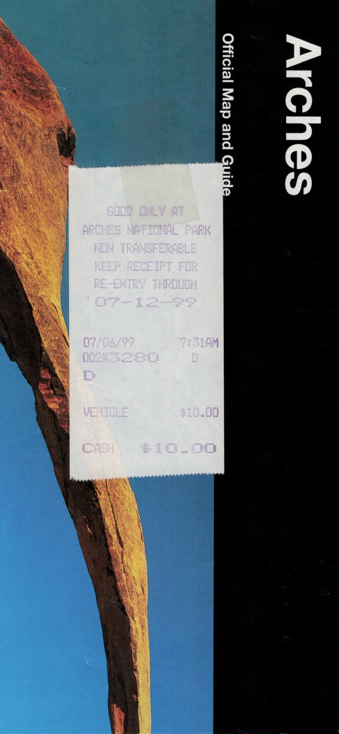 Scan of Arches National Park Official Map and Guide. A receipt is taped to the front of the guide showing a date and time of July 6, 1999 at 7:31 AM and entry price of $10.