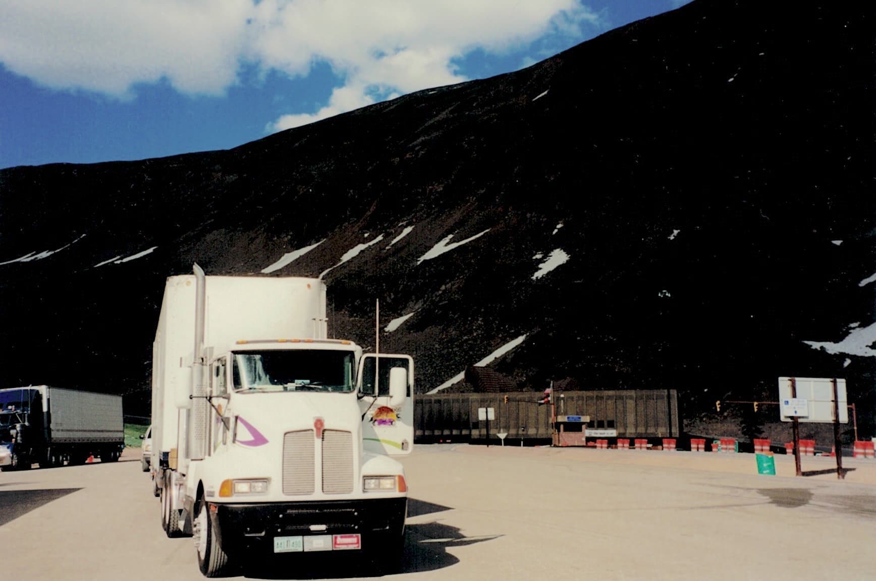 Doug Convente's Kenworth truck cab in front of the Eisenhower Tunnel on US Interstate 70.