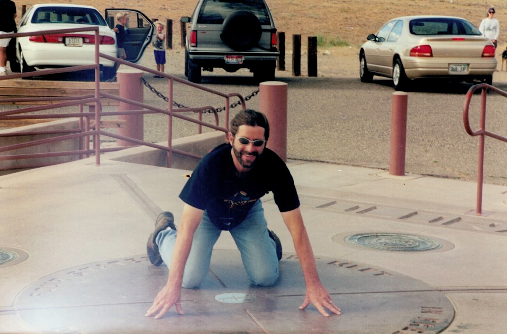 Doug Convente posing at Four Corners Monument.